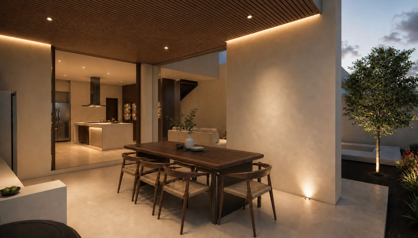 Perspectiva del comedor y la cocina de Casa Campestre con la escalera de piedra al fondo